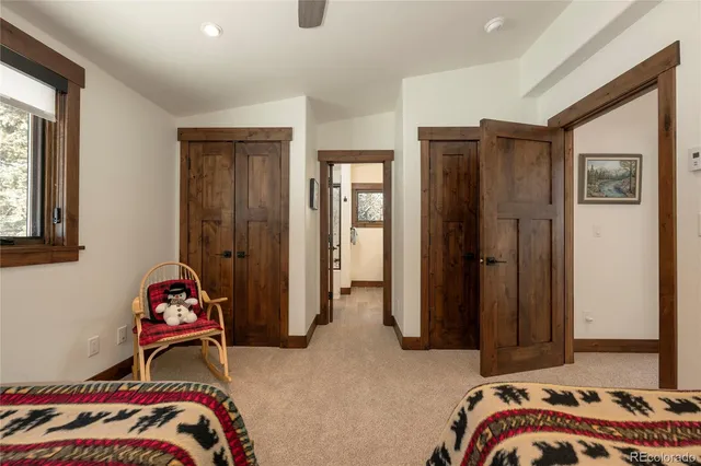 a en suite bathroom with a granite countertop sink and a mirror