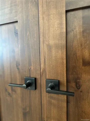 a bathroom with a bathtub shower sink vanity and mirror
