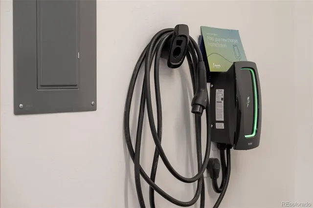 a view of a house with a door and wooden fence