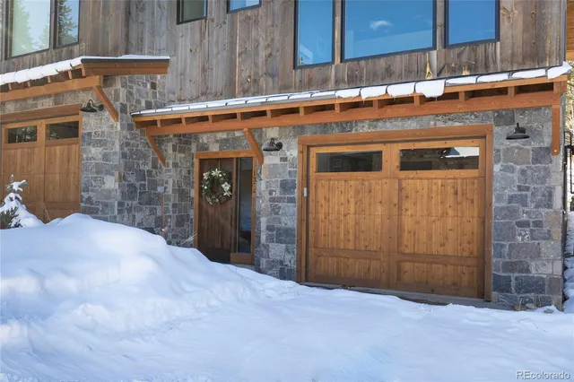 a view of a door and wooden wall