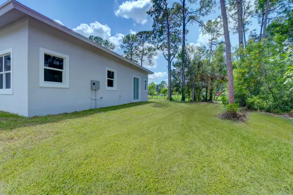 a backyard of a house with lots of green space
