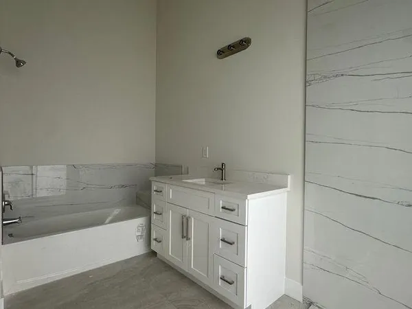 a bathroom with a sink and a bathtub