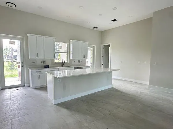 a large kitchen with cabinets