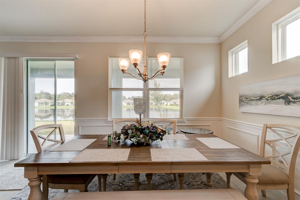 1706 Red Rock Road New Smyrna Beach, FL 32168 - Photo 15 of 27 a view of a dining room with furniture and window