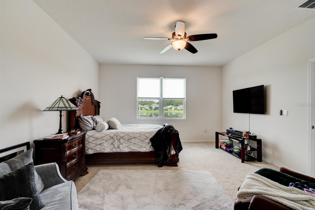 1706 Red Rock Road New Smyrna Beach, FL 32168 - Photo 20 of 27 a bedroom with bed tv and window