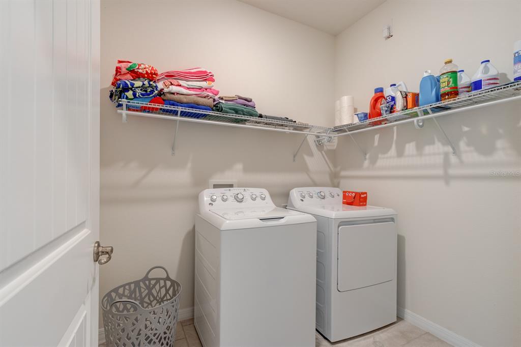 1706 Red Rock Road New Smyrna Beach, FL 32168 - Photo 10 of 27 a utility room with dryer and washer