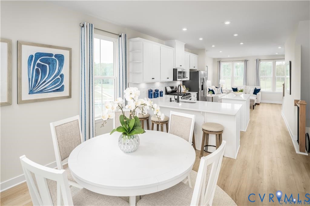 4717 Cloverleigh Drive Midlothian, VA 23112 - Photo 13 of 23 a dining room with furniture and wooden floor