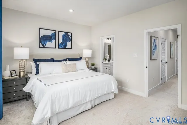 a bedroom with a bed and a painting