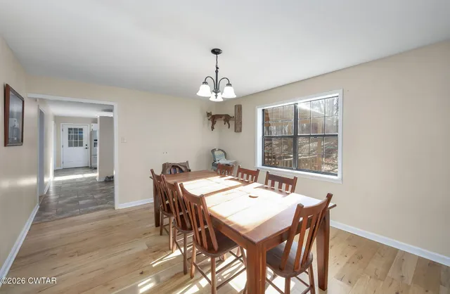 a dining room with a table chairs and a dining table