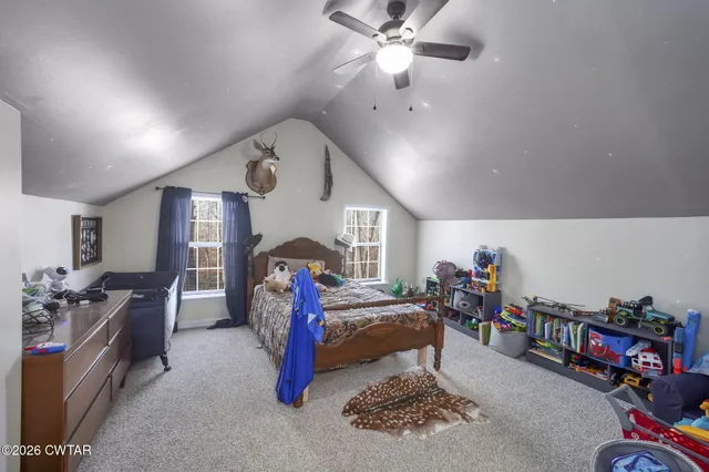 a bed room with furniture and wooden floor