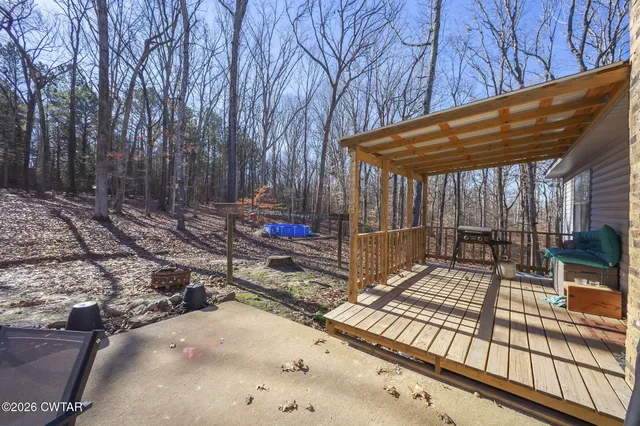 a view of a backyard with a patio