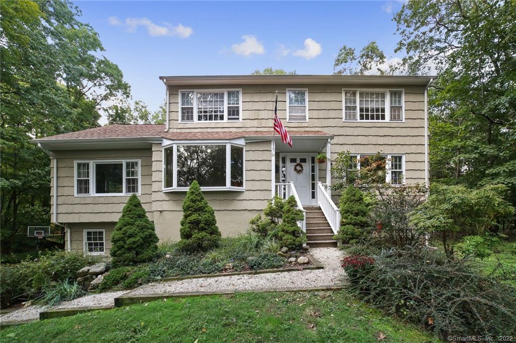 24 Seth Low Mountain Road Ridgefield, CT 06877 - Photo 1 of 1 front view of a house with a yard