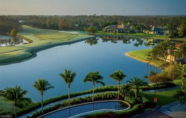 a view of a lake with a yard and lake view
