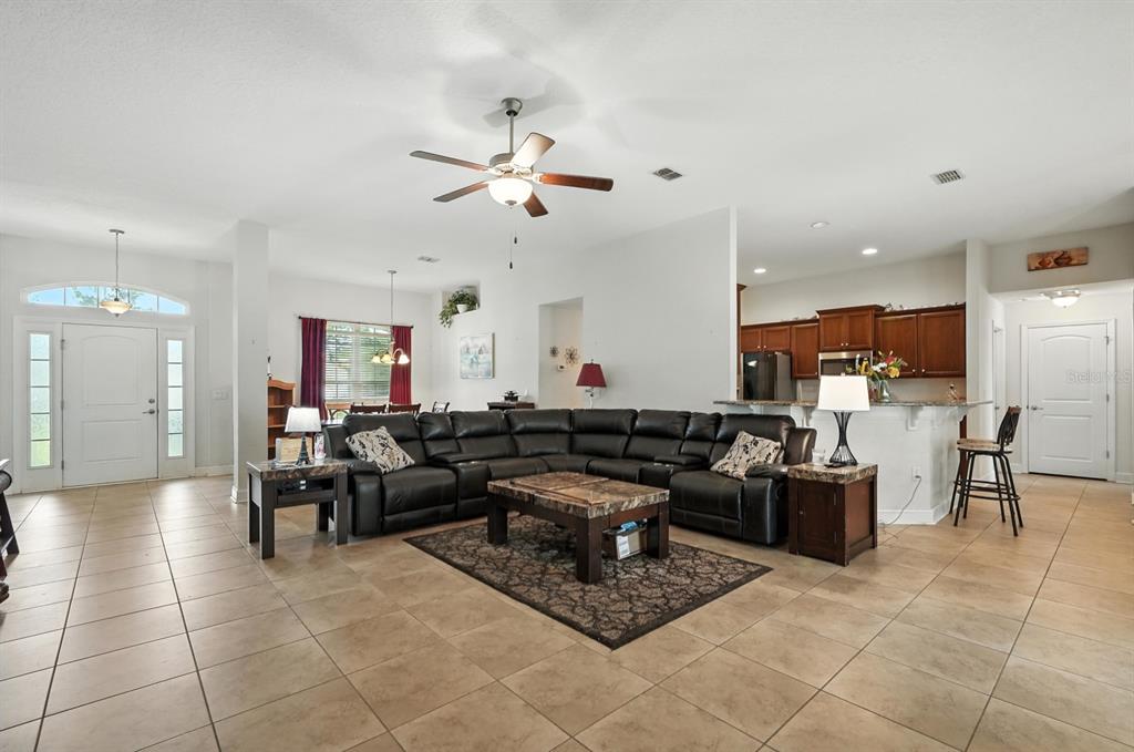 8 Zorro Court Palm Coast, FL 32164 - Photo 11 of 43 a living room with furniture and kitchen view