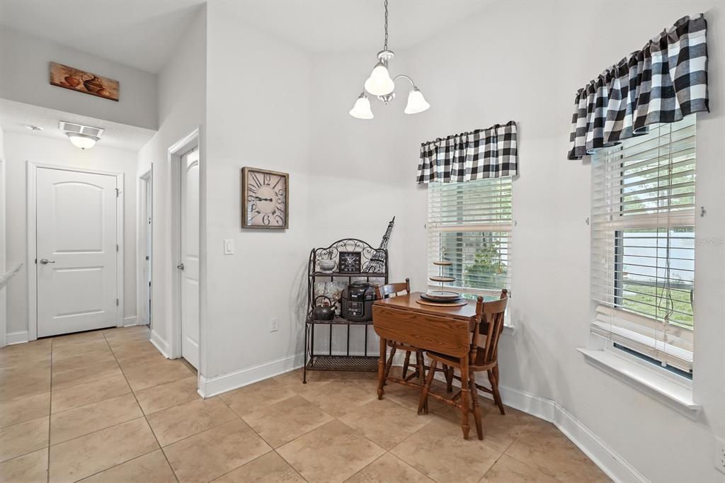 8 Zorro Court Palm Coast, FL 32164 - Photo 19 of 43 a view of a workspace with furniture and a window