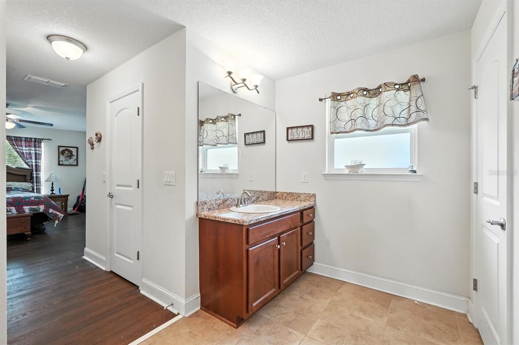 8 Zorro Court Palm Coast, FL 32164 - Photo 21 of 43 a view of a kitchen with cabinets and wooden floor