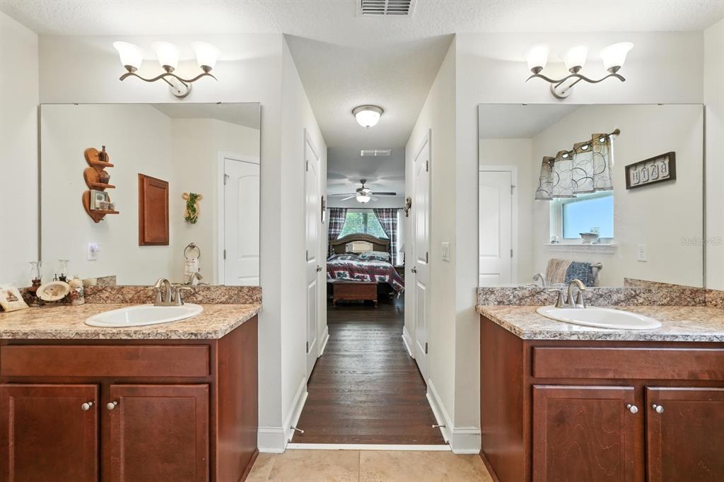 8 Zorro Court Palm Coast, FL 32164 - Photo 22 of 43 a en suite bathroom with a sink and a mirror