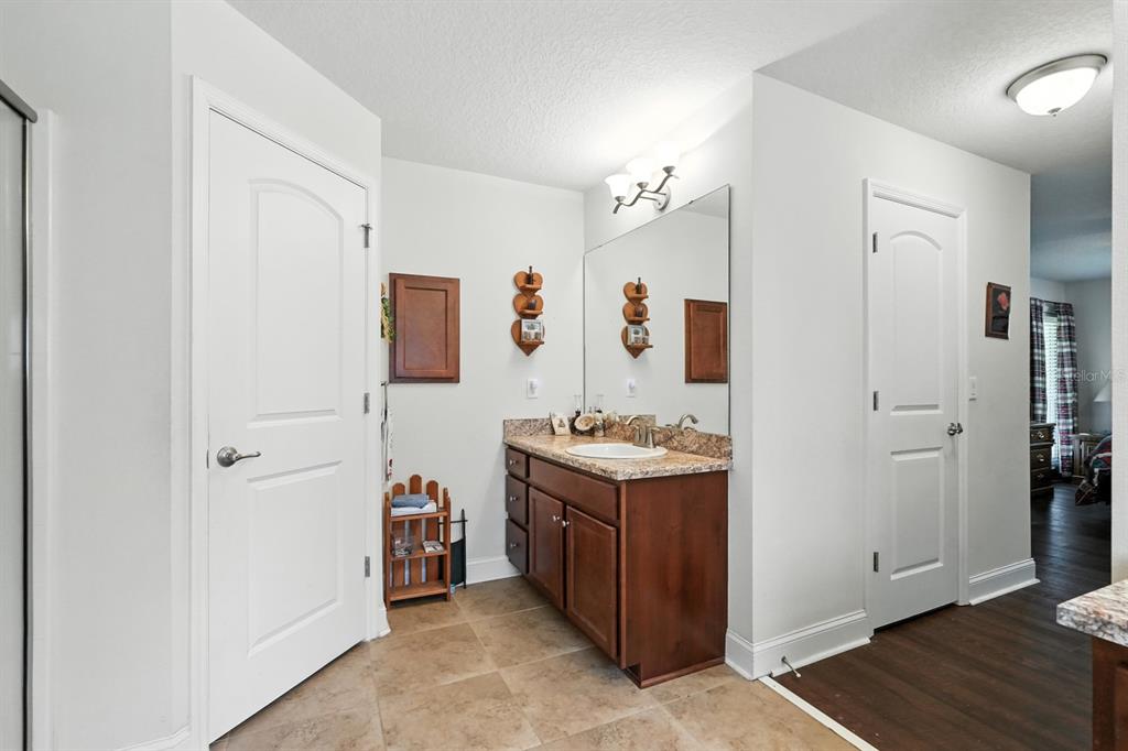 8 Zorro Court Palm Coast, FL 32164 - Photo 23 of 43 a view of a kitchen with cabinets and wooden floor