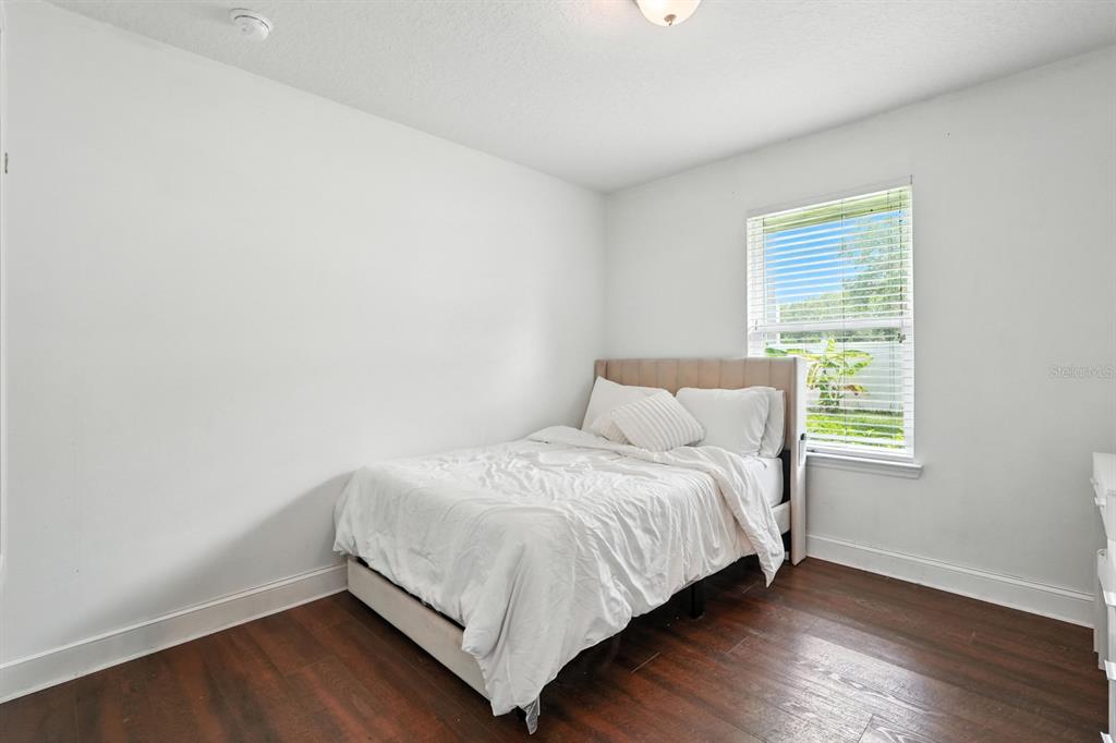 8 Zorro Court Palm Coast, FL 32164 - Photo 24 of 43 a bedroom with a bed and window