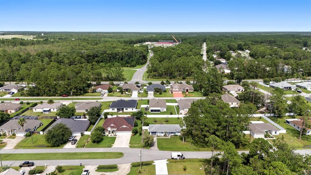 8 Zorro Court Palm Coast, FL 32164 - Photo 37 of 43 an aerial view of residential houses with outdoor space and trees