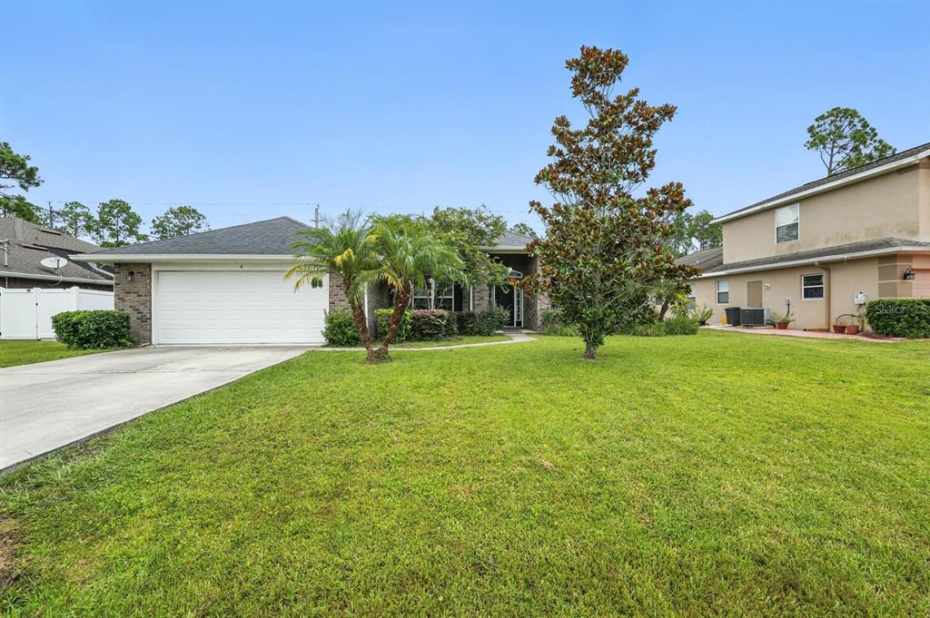 8 Zorro Court Palm Coast, FL 32164 - Photo 42 of 43 a house view with garden space