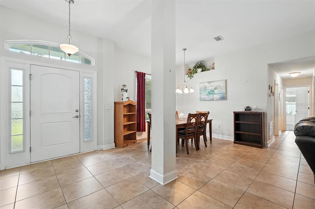 8 Zorro Court Palm Coast, FL 32164 - Photo 5 of 43 a view of a dining room with furniture and chandelier