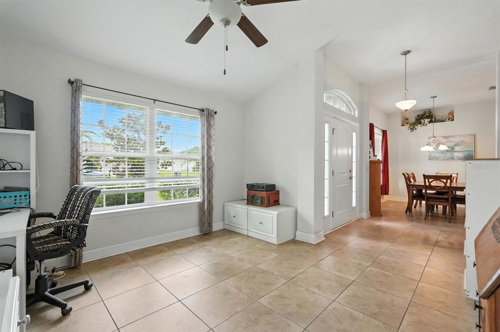 8 Zorro Court Palm Coast, FL 32164 - Photo 6 of 43 a large living room with furniture and a large window