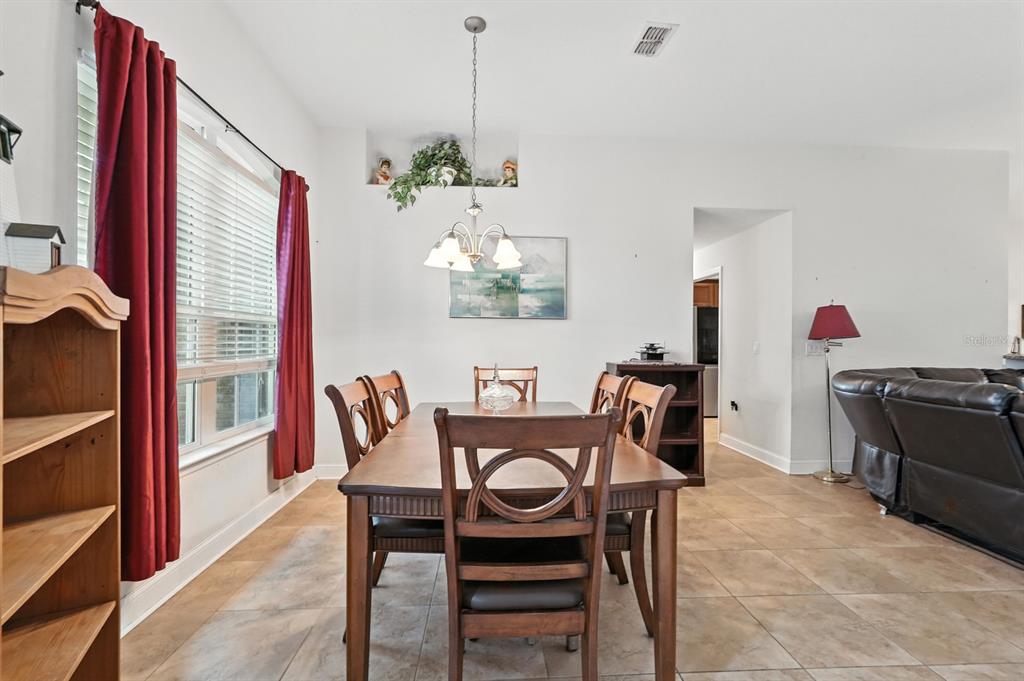 8 Zorro Court Palm Coast, FL 32164 - Photo 8 of 43 a view of a dining room with furniture window and outside view