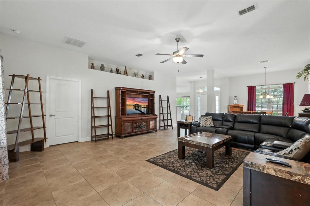 8 Zorro Court Palm Coast, FL 32164 - Photo 10 of 43 a living room with furniture and a flat screen tv