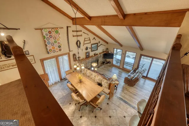 a bathroom with a sink a toilet a mirror and shower