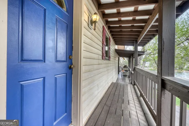 a living room with furniture and a kitchen view