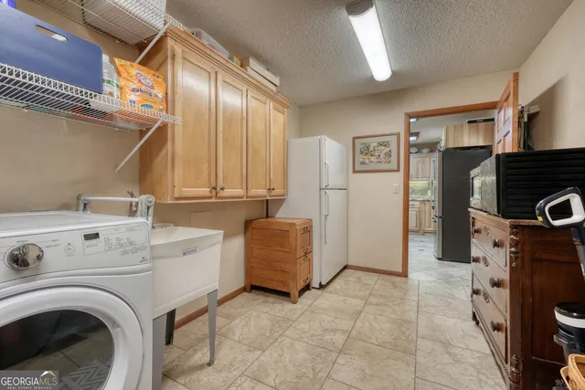 a dining room with furniture and a chandelier