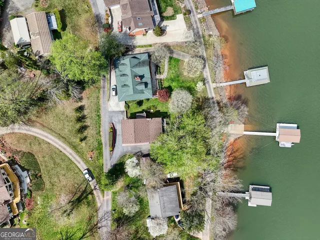 a view of a backyard with a table and chairs