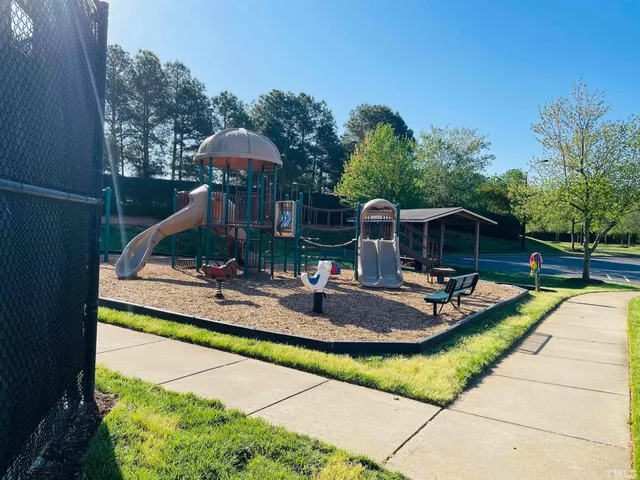 a front view of house with yard and outdoor seating