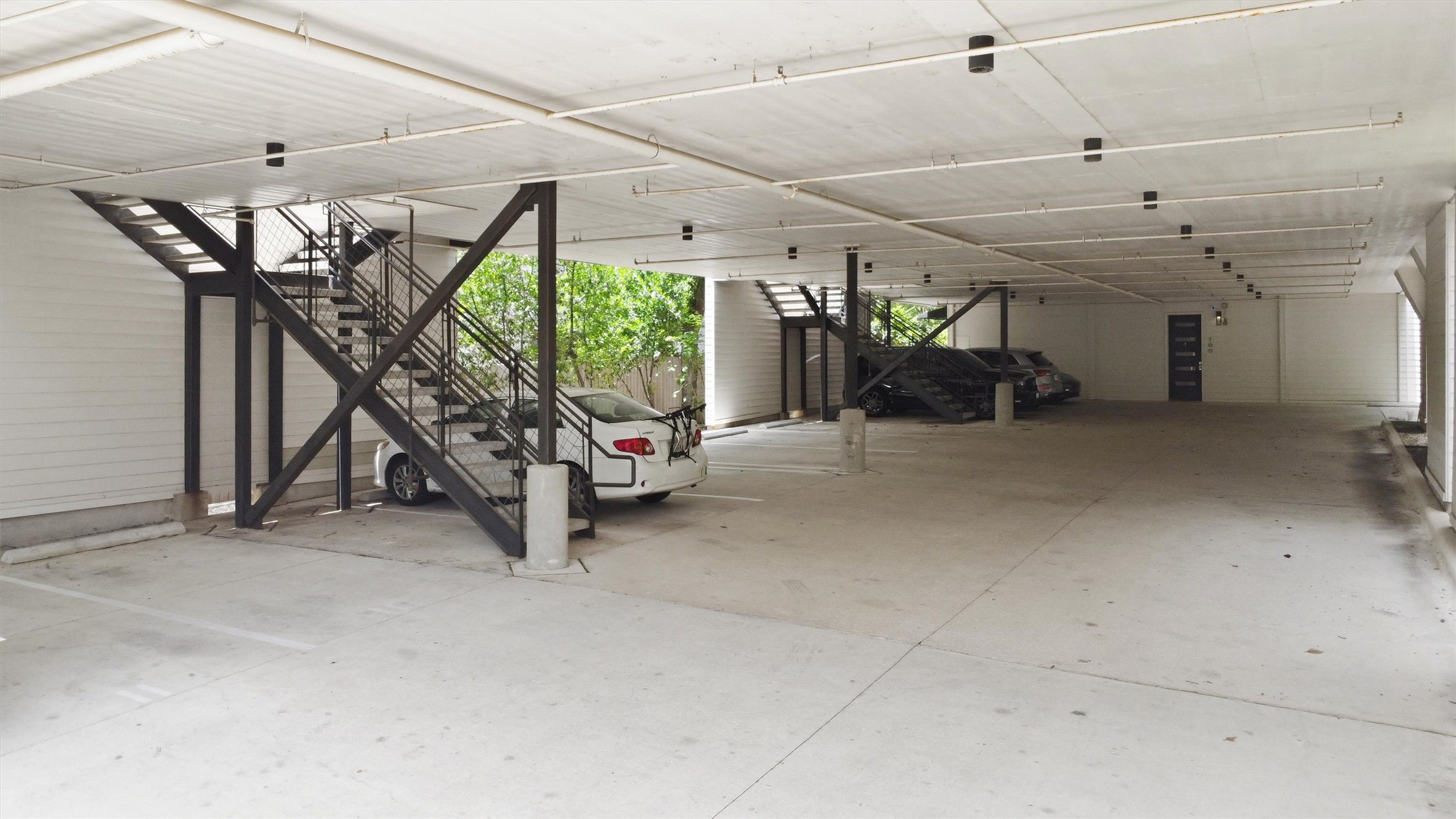 2314 Enfield Road, Unit 203 Austin, TX 78703 - Photo 33 of 37 Two covered carport spaces included — a rare and valuable perk for in-town Austin condo living.