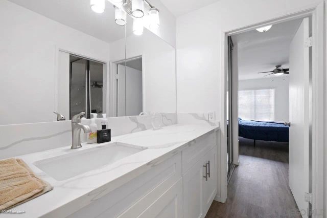 a en suite bathroom with a sink and a mirror