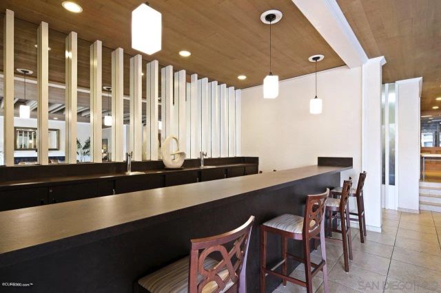 a large kitchen with a table and chairs in it