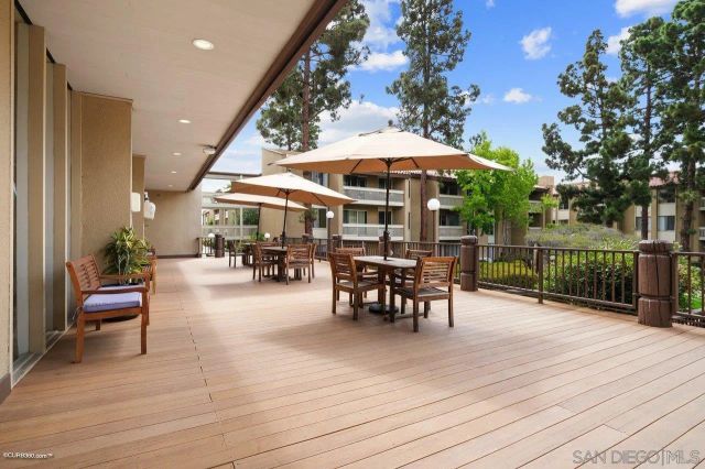 an outdoor space with furniture and umbrella