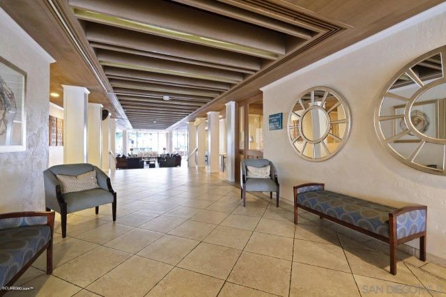 a living room with furniture and a clock