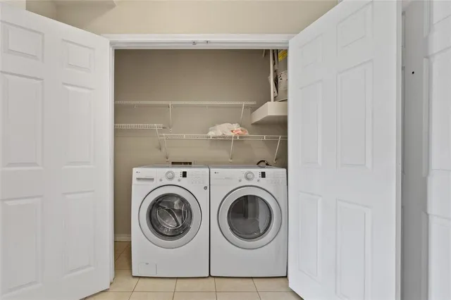 a view of residential houses with outdoor space and swimming pool