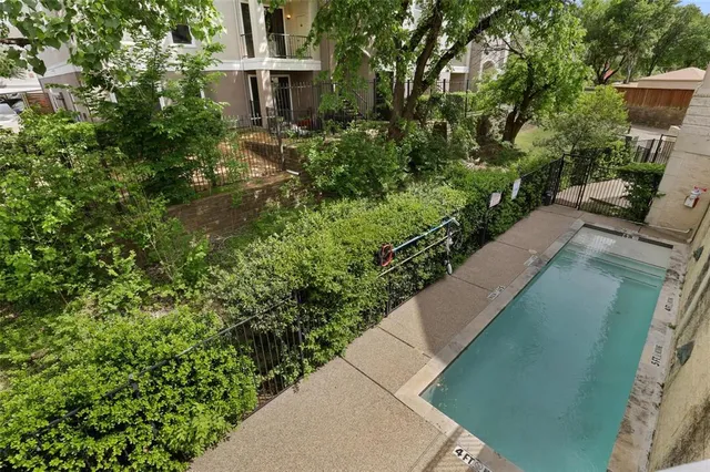 a view of a swimming pool with a patio