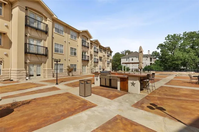 a view of a livingroom with a ceiling fan wooden floor and a ceiling fan