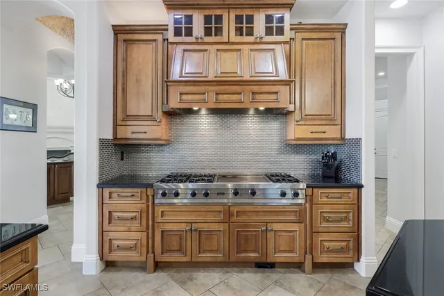 a kitchen with cabinets and appliances