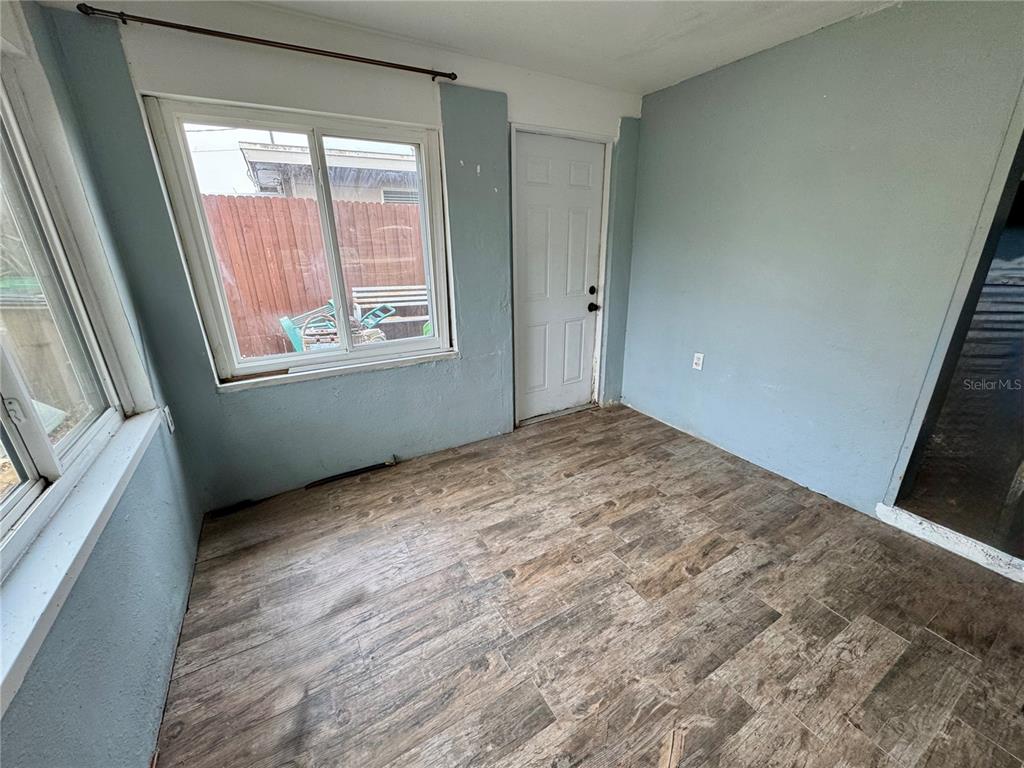 200 10th Avenue North Indian Rocks Beach, FL 33785 - Photo 8 of 15 a view of an empty room and window
