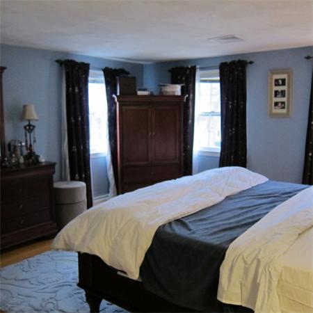 24 Stinson Road Andover, MA 01810 - Photo 12 of 22 a bedroom with a bed and a dresser