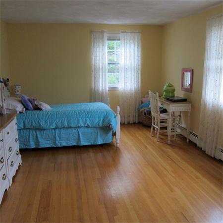 24 Stinson Road Andover, MA 01810 - Photo 15 of 22 a living room with furniture and a wooden floor