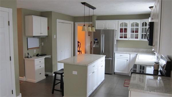 24 Stinson Road Andover, MA 01810 - Photo 3 of 22 a kitchen with refrigerator a stove and cabinets
