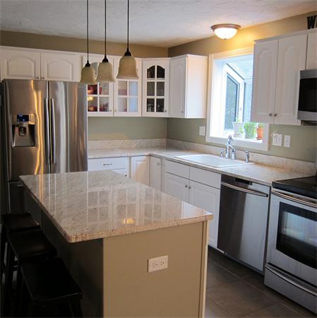 24 Stinson Road Andover, MA 01810 - Photo 4 of 22 a kitchen with stainless steel appliances a sink stove and refrigerator