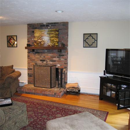 24 Stinson Road Andover, MA 01810 - Photo 8 of 22 a living room with furniture and a flat screen tv