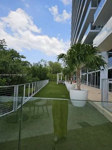 a living room with furniture window and wooden floor